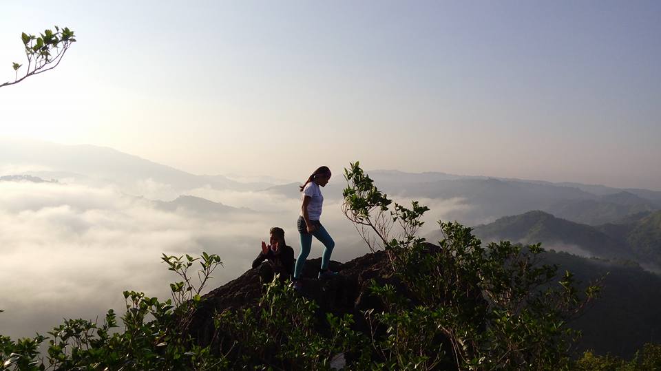 Mt. Binacayan view on top with clouds surrounding the sky 