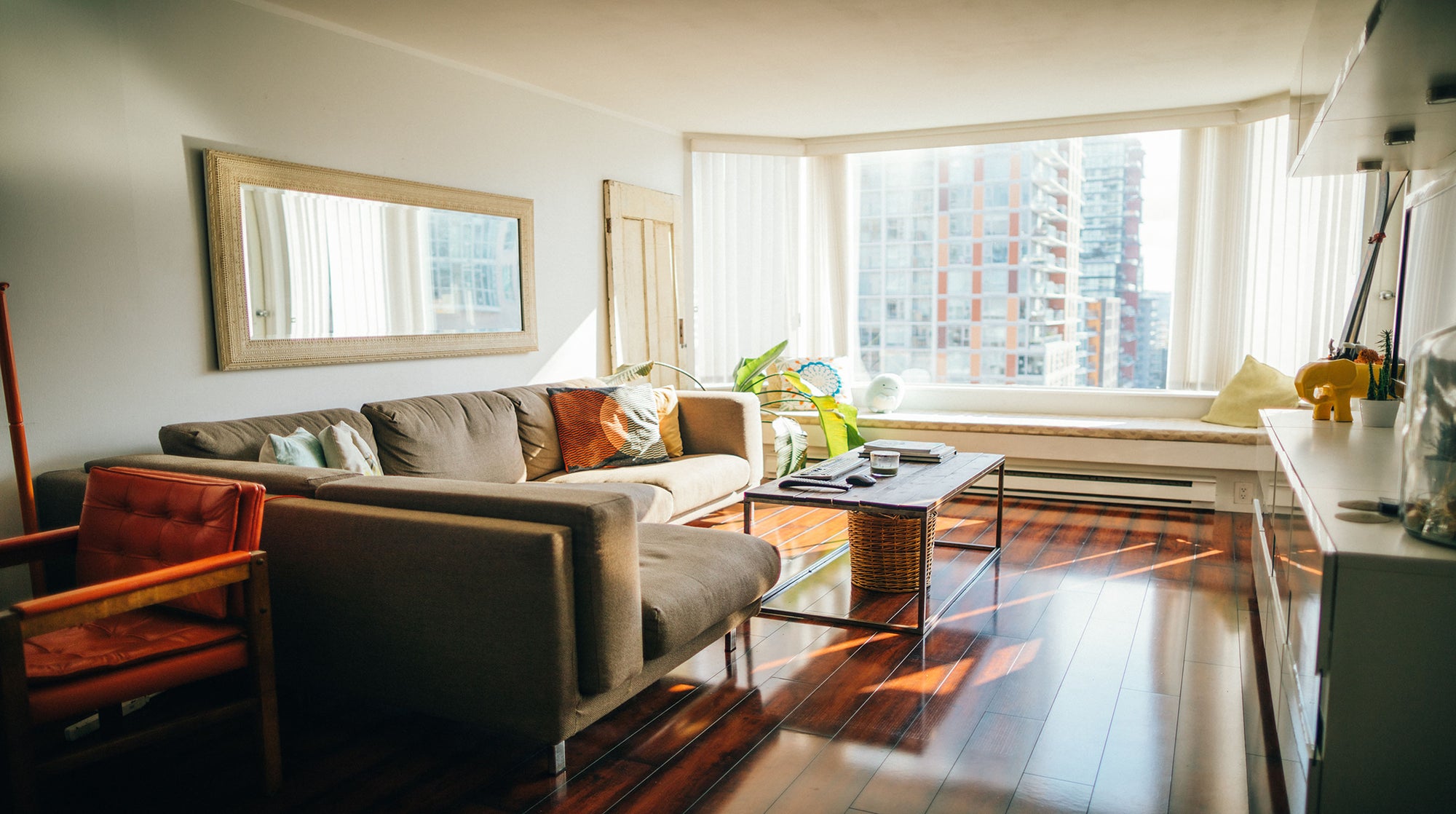 Photo of a condo unit's living room area with a bay window